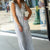 Vertical Striped Faux Wrap Jumpsuit