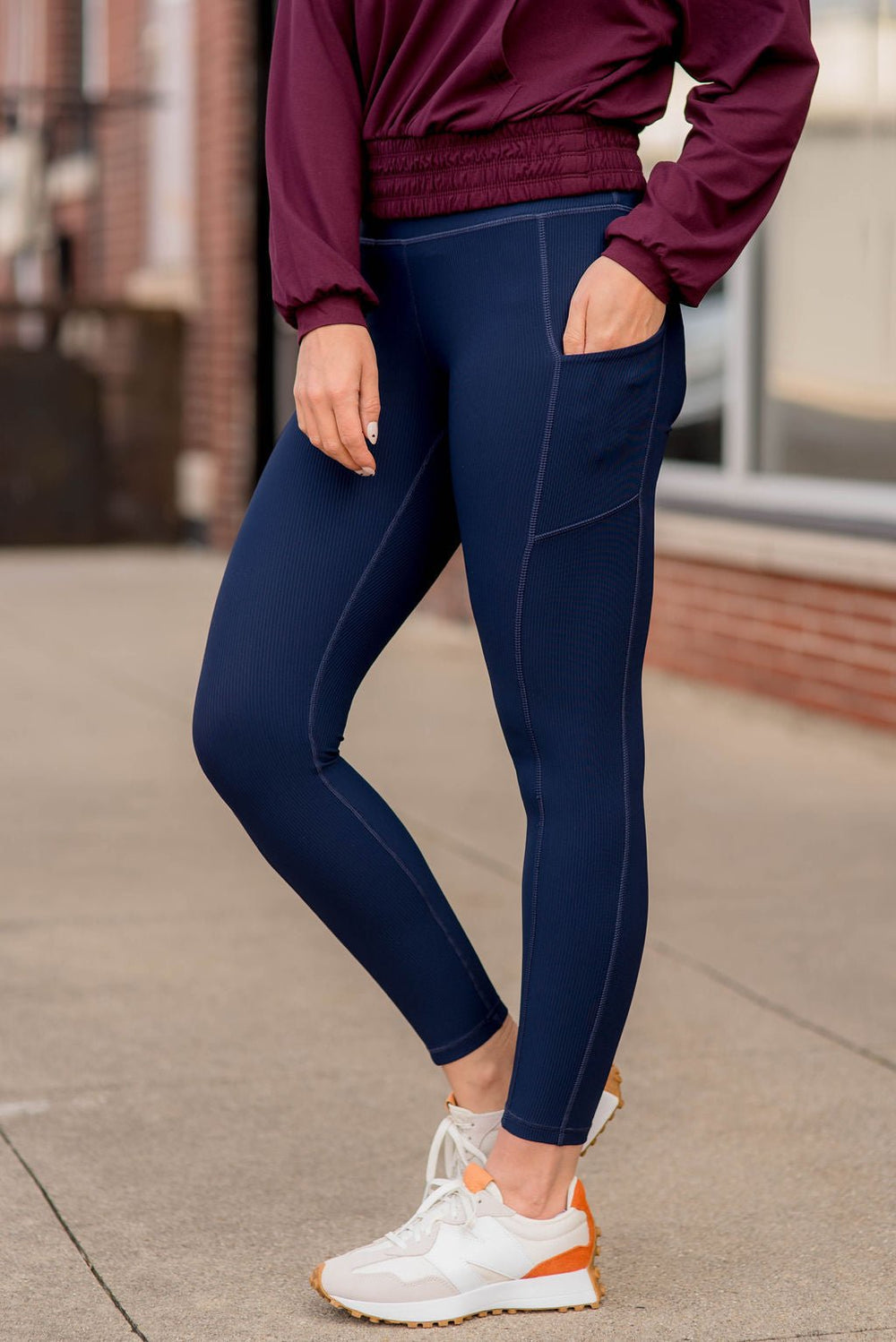 Navy Lululemon leggings with side ruffle details and pockets