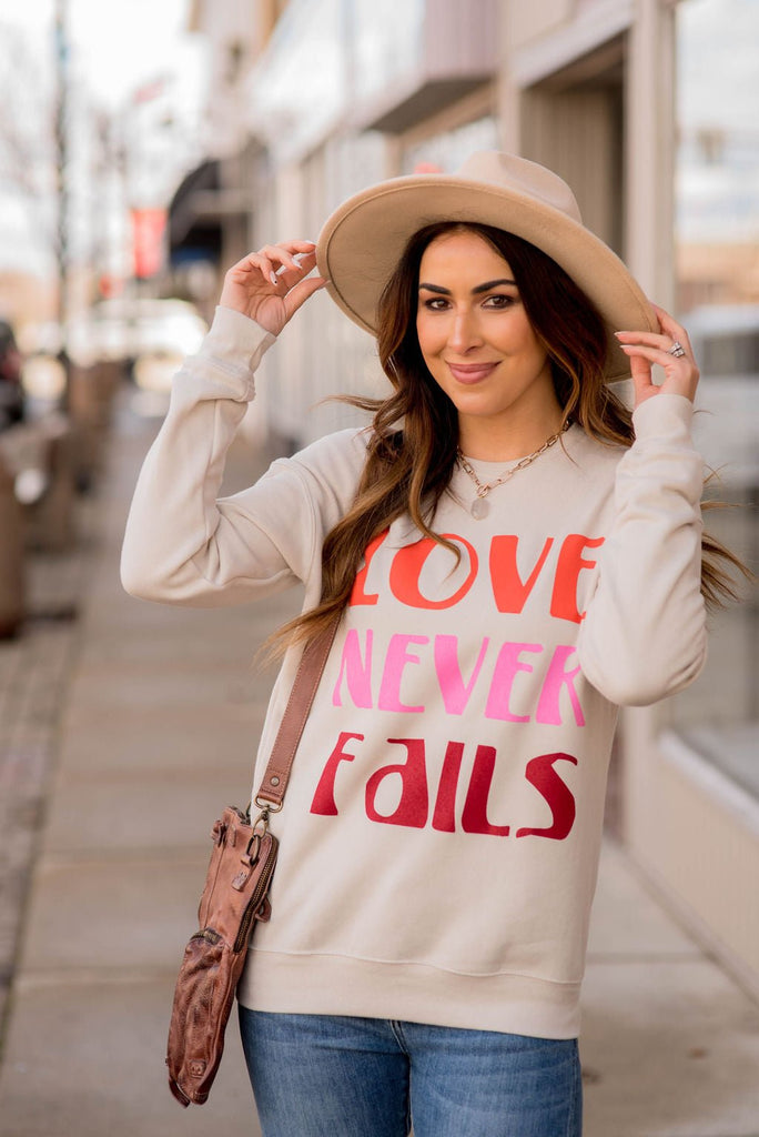 Love Never Fails Graphic Crewneck - Betsey's Boutique Shop -