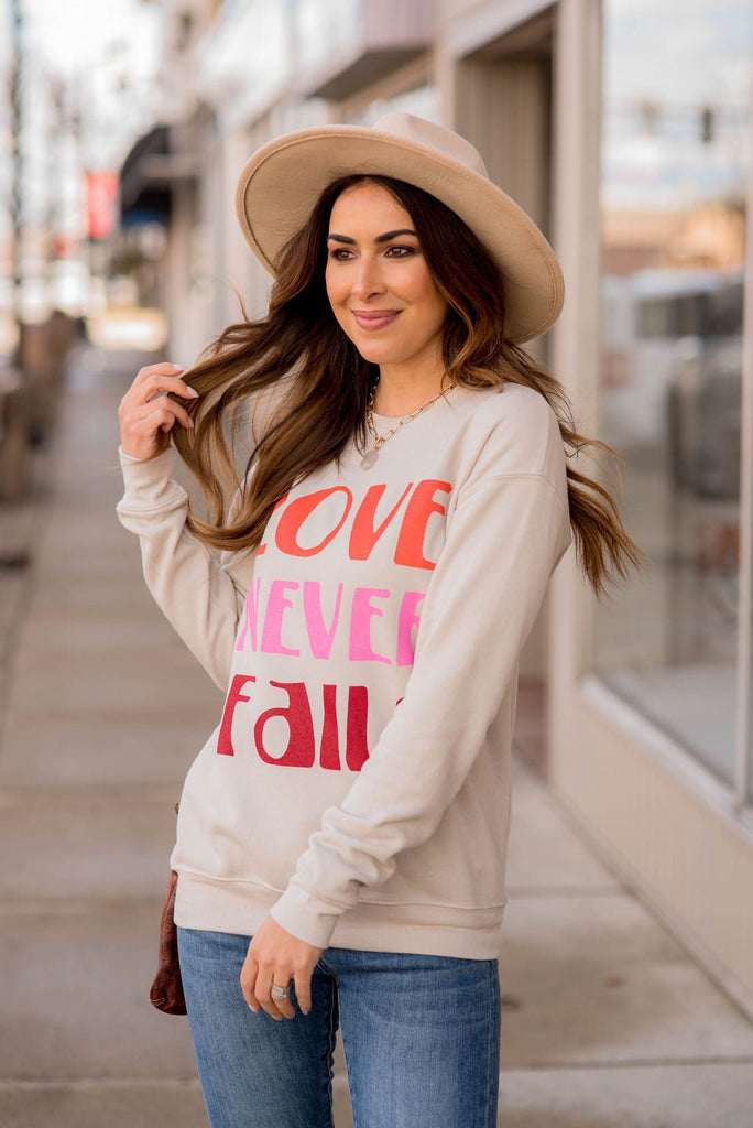 Love Never Fails Graphic Crewneck - Betsey's Boutique Shop -