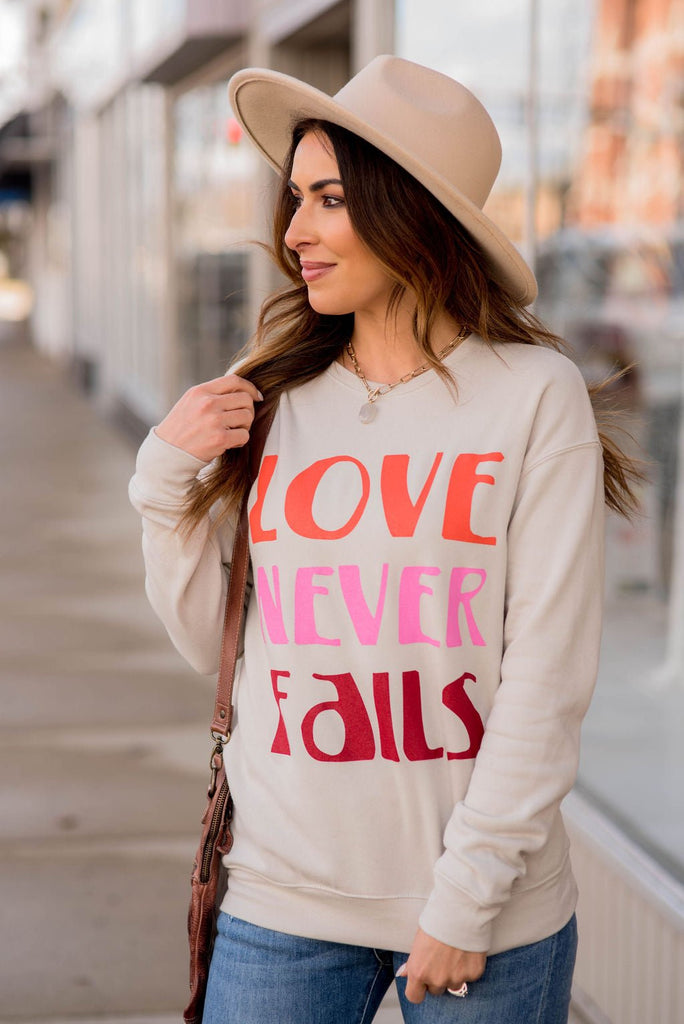 Love Never Fails Graphic Crewneck - Betsey's Boutique Shop -