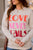 Love Never Fails Graphic Crewneck - Betsey's Boutique Shop -